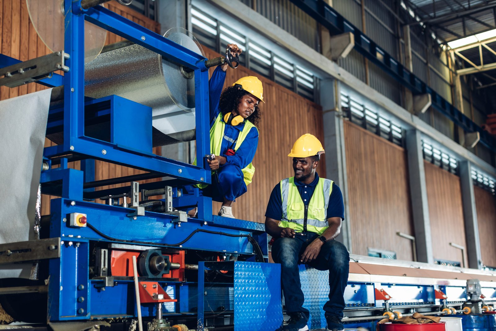 Foreman or worker work at factory site check up machine or produ Foreman or worker work at factory site check up machine or products in site. Engineer or Technician checking Material or Machine on Plant. Industrial and Factory.