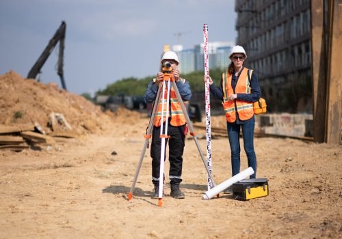 Construction surveyor and engineer working on pipeline infrastructure